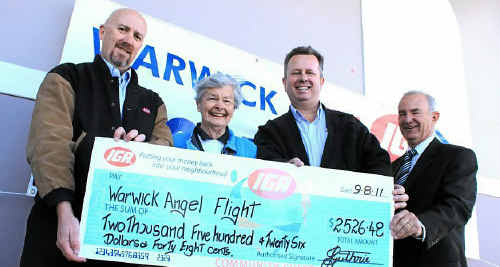 Angel Flight’s Val Murphy (second from left) receives a cheque from John Guthrie, store manager Rob Norris and Warwick Daily News general manager Peter Read. Angel Flight’s Val Murphy (second from left) receives a cheque from John Guthrie, store manager Rob Norris and Warwick Daily News general manager Peter Read.